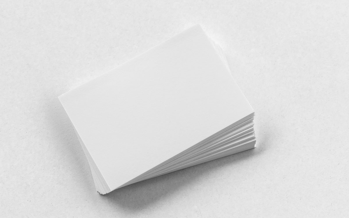 A stack of freshly printed business cards